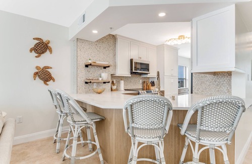 Seawinds Condo Condo | Renovated direct oceanfront corner 2/2 with a large balcony, heated pool, and garage