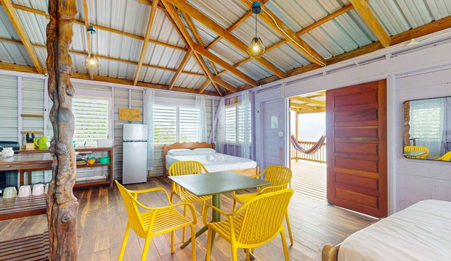 Rustic Oceanfront Cabin on Private Island with beach access & kitchen in Placencia