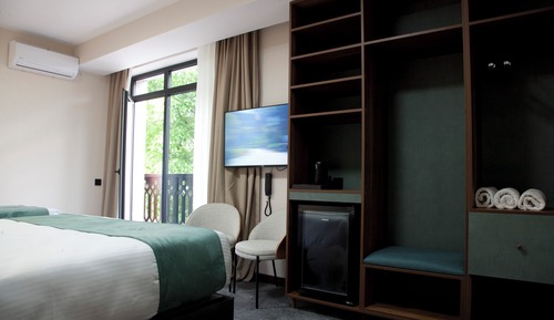 Family Triple Room, Balcony, Garden View