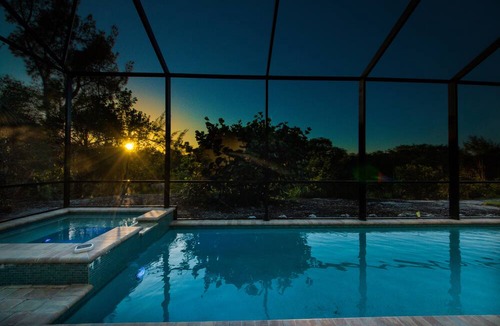 Beachview Country Club Estates House | Key West appeal & gorgeous Sanibel River views& bicycles -Villa Calypso Tides- Roelens Vacations